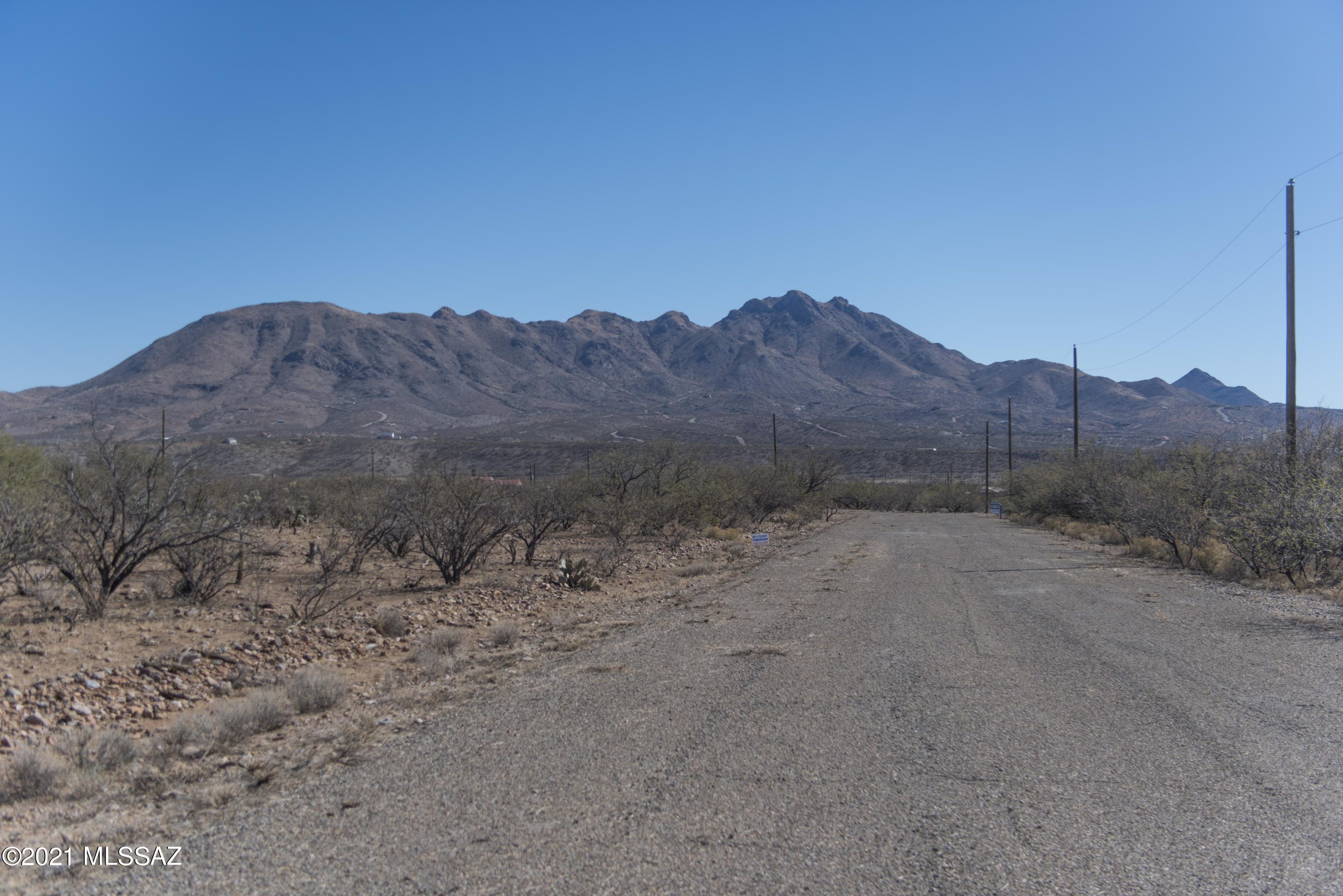 1781 Laponia Corte, Unit 28 Rio Rico, AZ 85648 - Photo 17 of 25 a view of a dry field with mountains in the background
