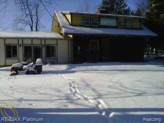 6136 Brophy Road Howell, MI 48855 - Photo 14 of 25 side of home needing repair