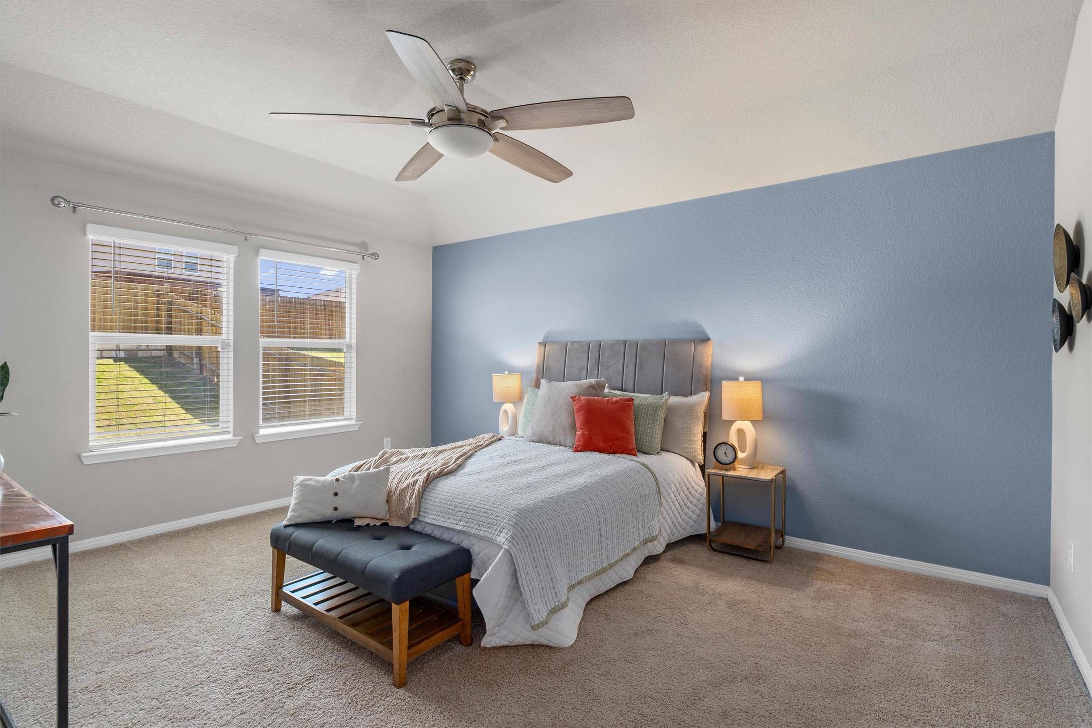 19525 Abigail Fillmore Road Manor, TX 78653 - Photo 13 of 38 An inviting bedroom with plush carpet and ample natural light, creating a serene personal retreat.