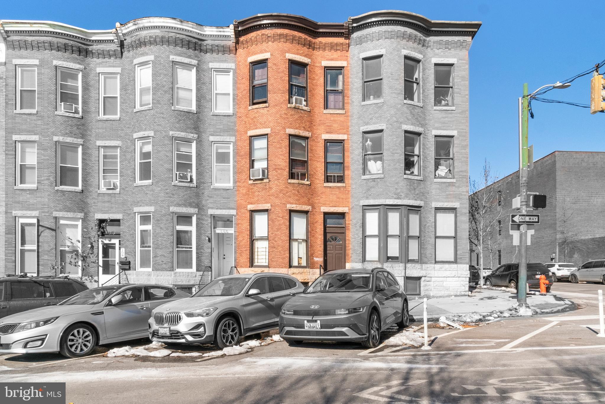 112 East 20th Street Baltimore, MD 21218 - Photo 1 of 23 a front view of a building with parking space