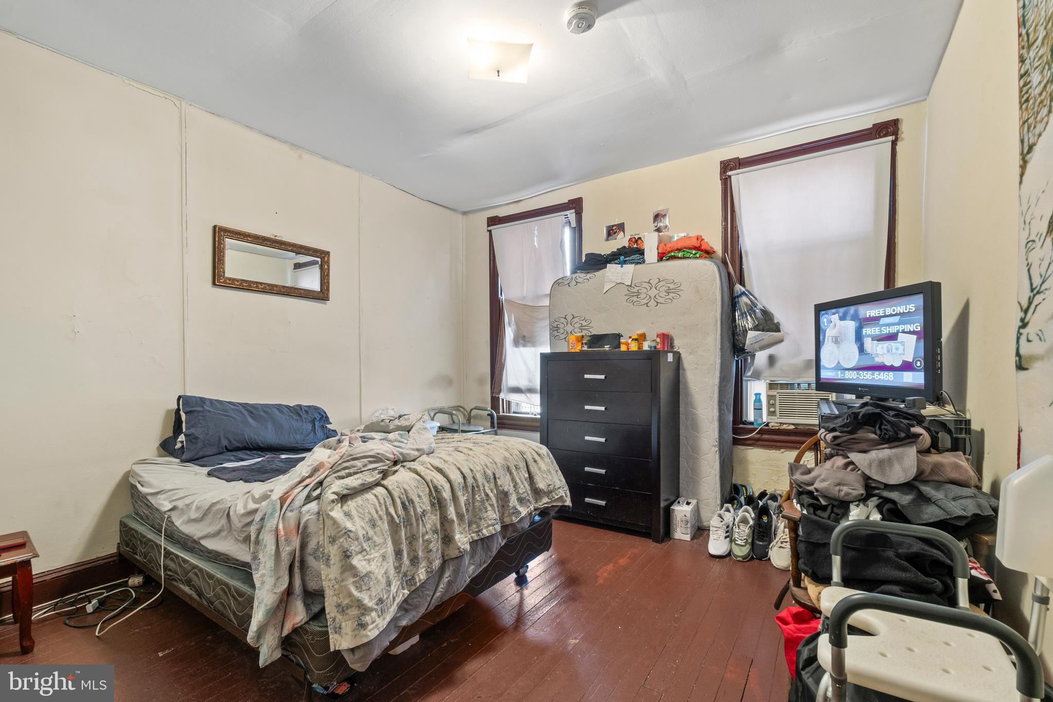 112 East 20th Street Baltimore, MD 21218 - Photo 15 of 23 a bedroom with bed and a furniture