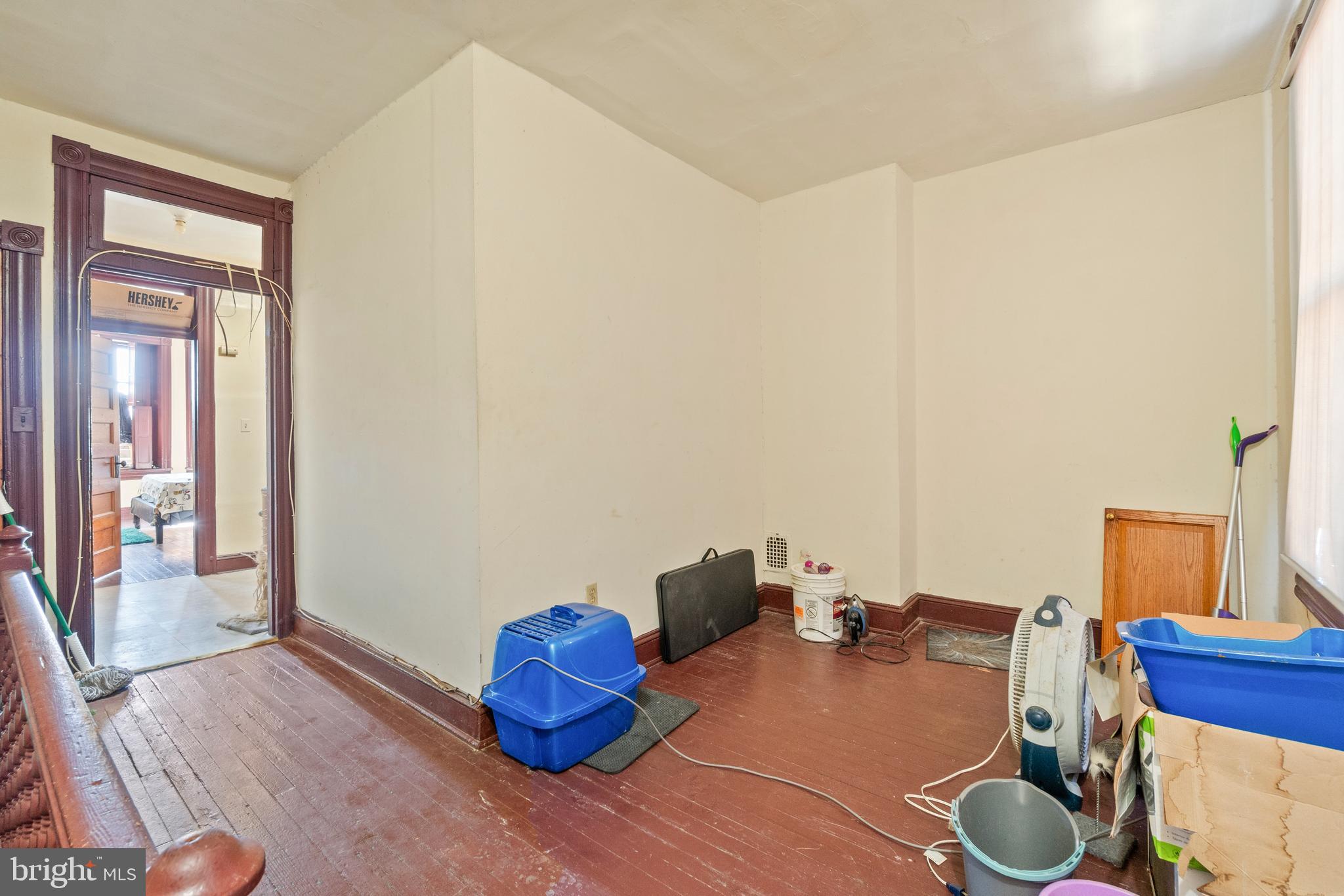 112 East 20th Street Baltimore, MD 21218 - Photo 5 of 23 a room with furniture and a window