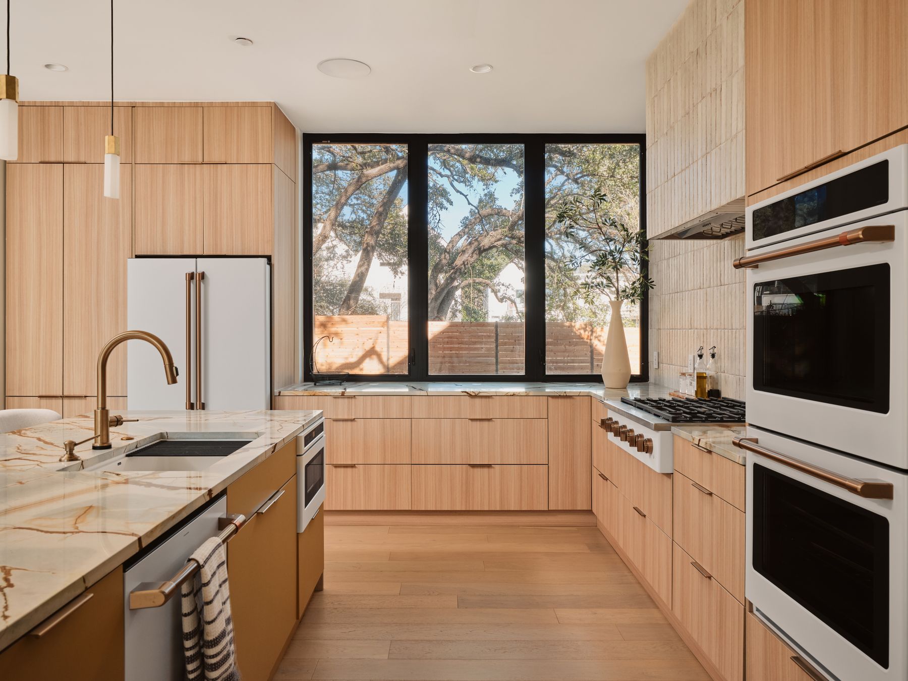 3209 Clawson Road Austin, TX 78704 - Photo 11 of 30 a kitchen with a sink stove and cabinets