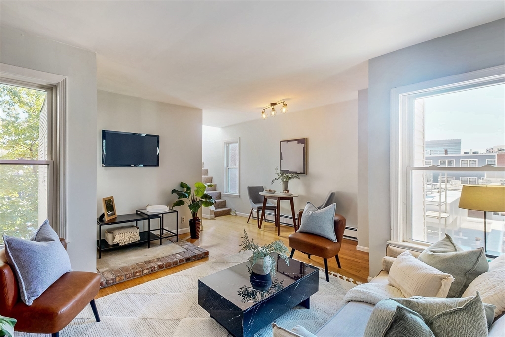 29 Eden Street, Unit 3 Boston, MA 02129 - Photo 3 of 15 a living room with furniture and a flat screen tv