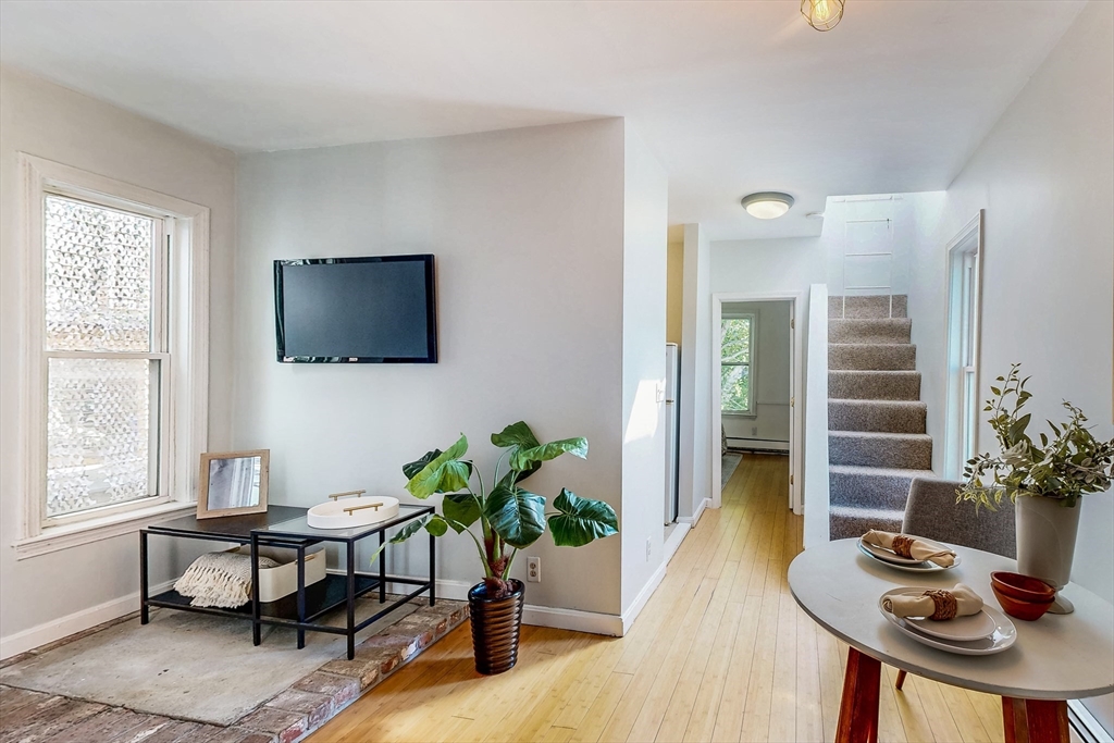 29 Eden Street, Unit 3 Boston, MA 02129 - Photo 5 of 15 a living room with furniture potted plant and a window
