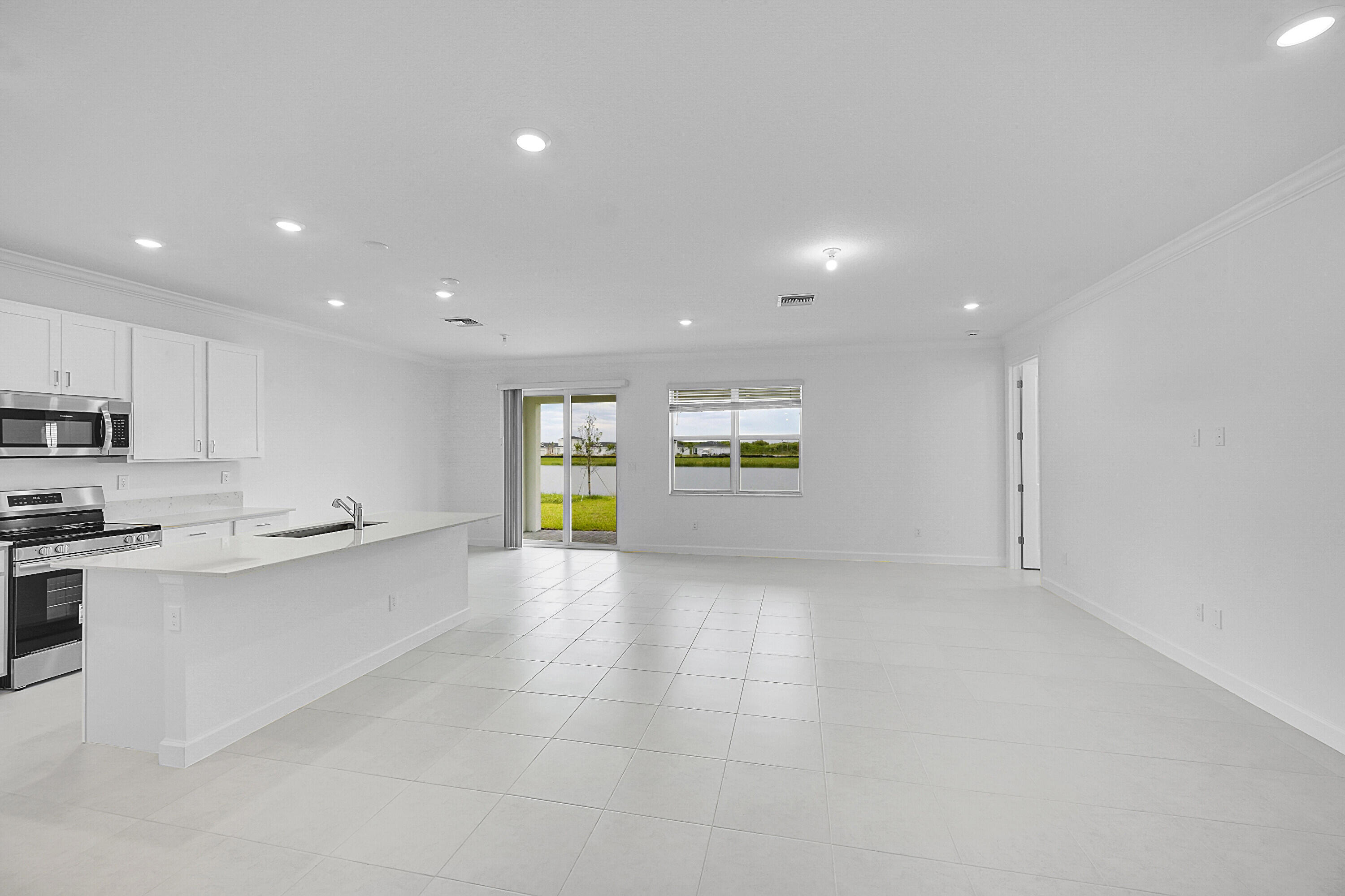 3532 Angler Drive Fort Pierce, FL 34946 - Photo 13 of 31 a kitchen with stainless steel appliances a refrigerator and a sink