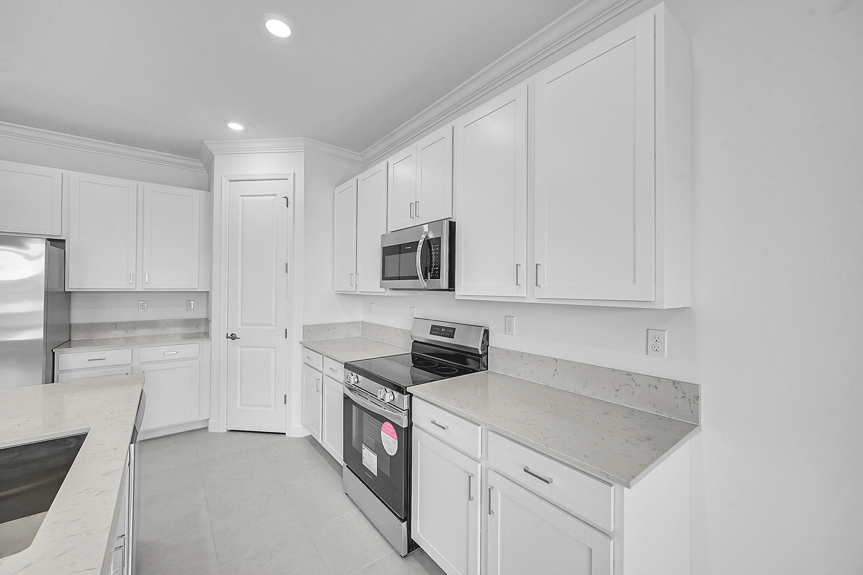 3532 Angler Drive Fort Pierce, FL 34946 - Photo 21 of 31 a kitchen with stainless steel appliances granite countertop a sink and a stove