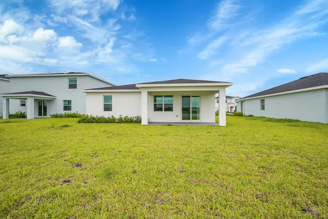 a front view of house with an outdoor space and seating