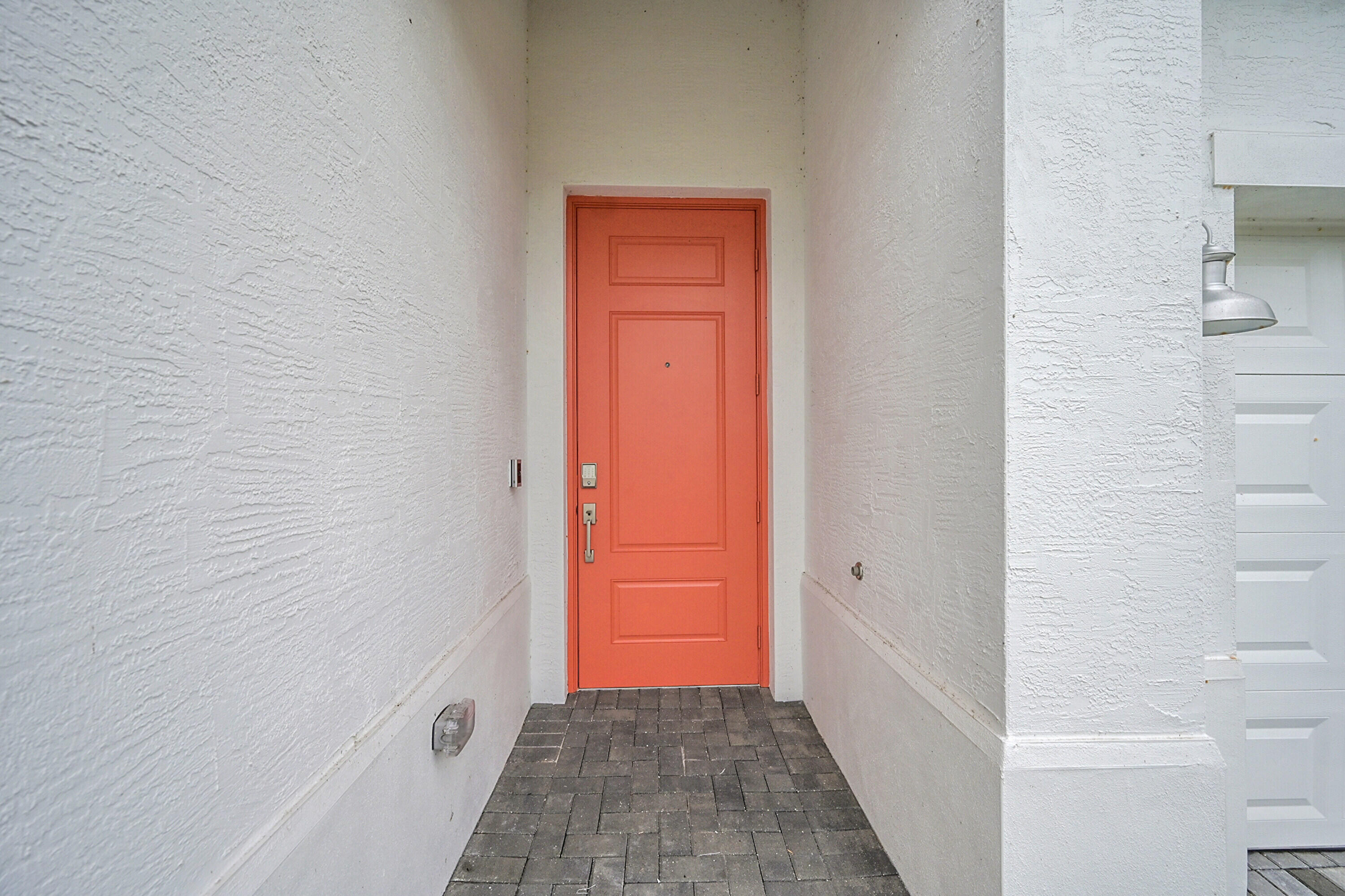 3532 Angler Drive Fort Pierce, FL 34946 - Photo 3 of 31 a view of a hallway with wooden floor and a bathroom