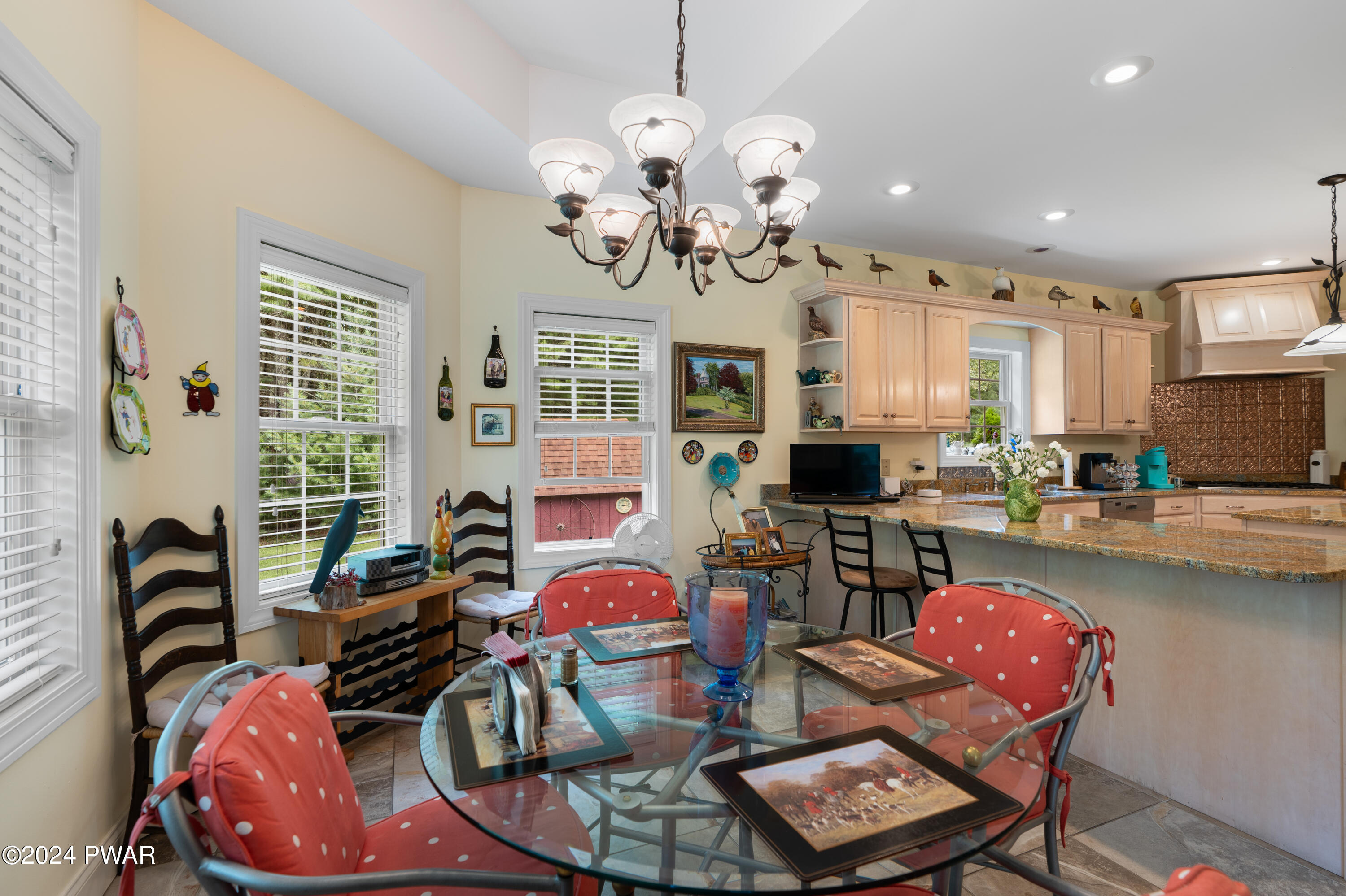 208 Long Meadow Road Milford, PA 18337 - Photo 27 of 64 a view of a dining room with furniture and chandelier