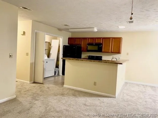 a view of kitchen and stainless steel appliances