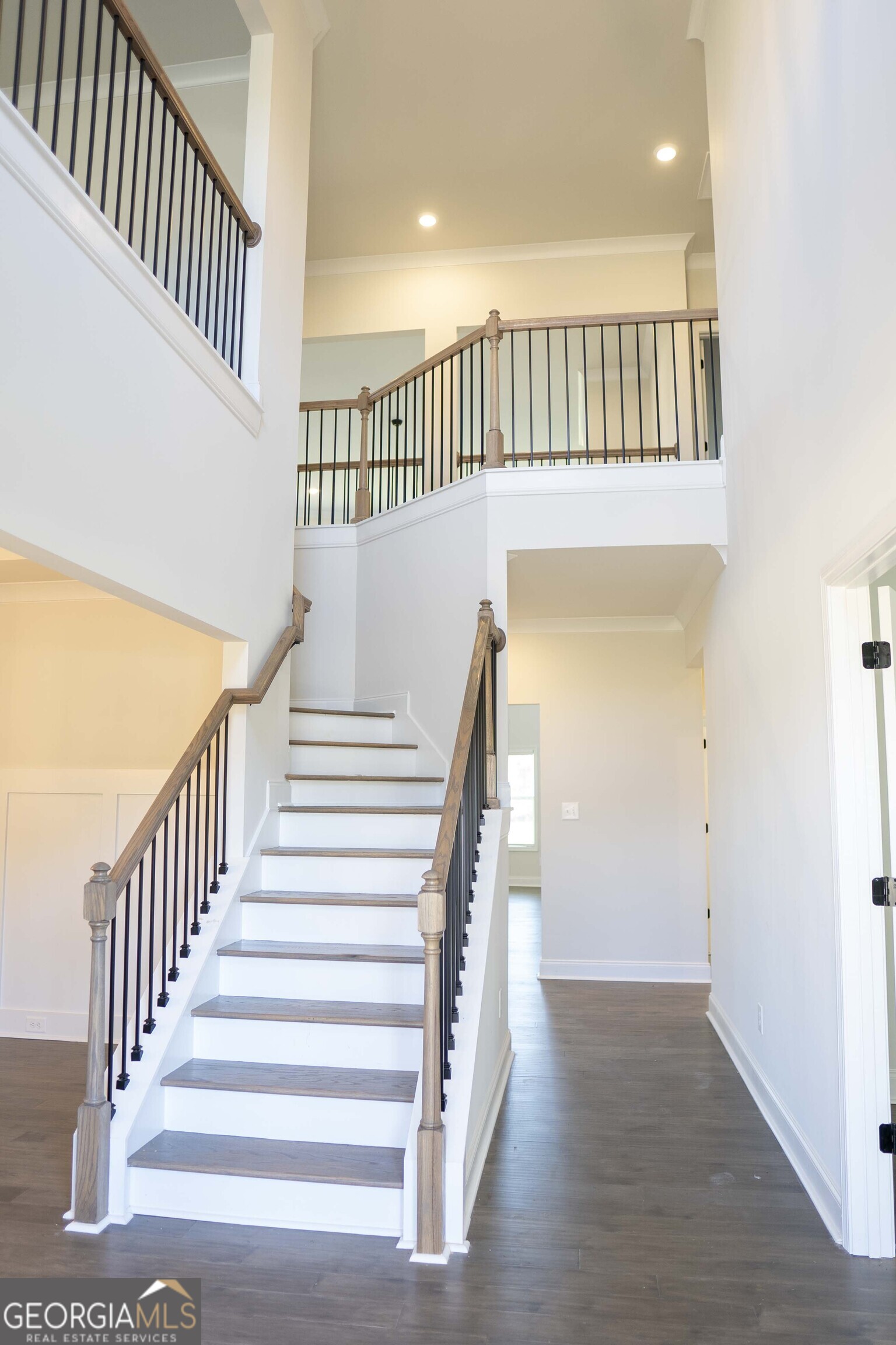 600 Beaver Court Perry, GA 31069 - Photo 6 of 48 a view of staircase with white walls and a window