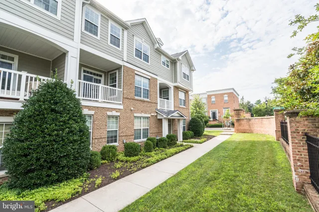 a view of a front of a building with a yard