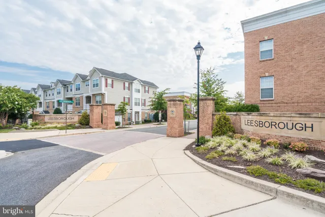 a front view of a building with retail shops