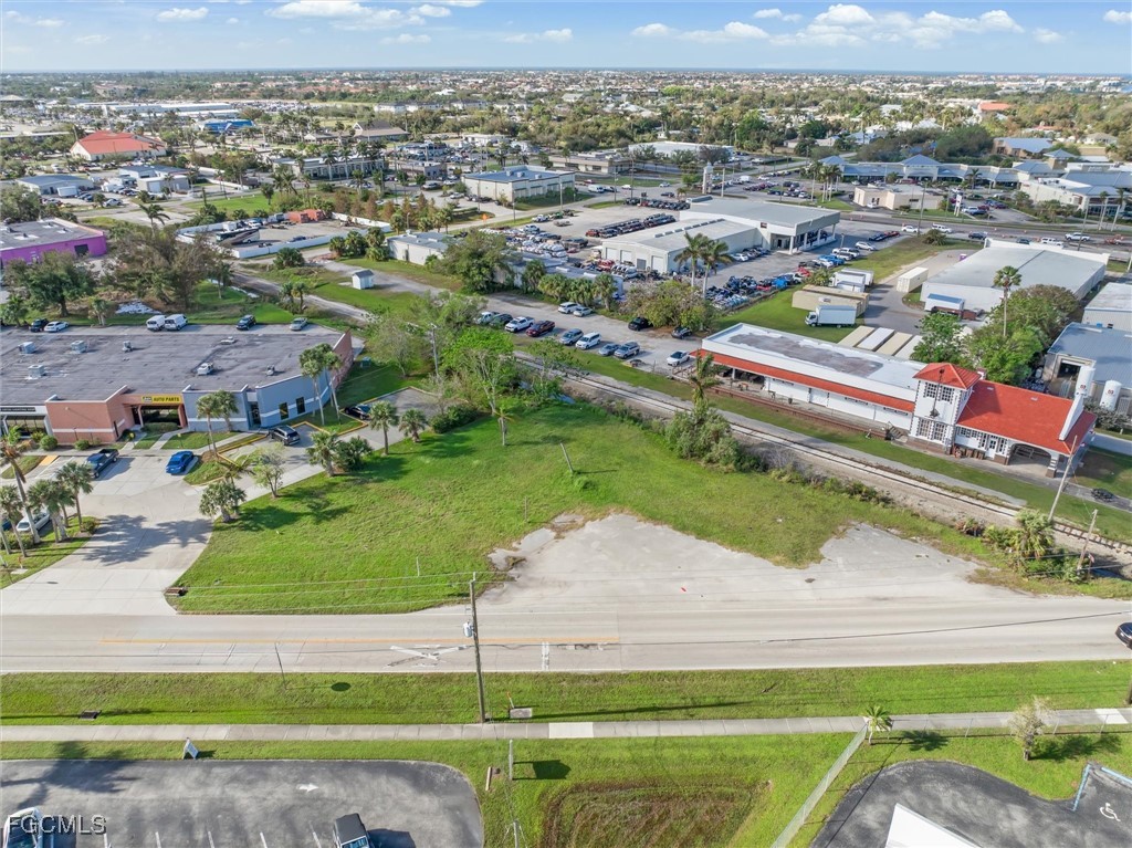an aerial view of residential houses with outdoor space and river