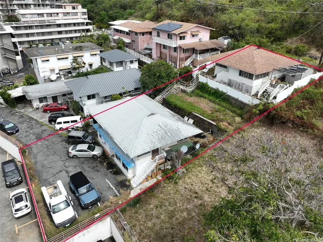 an aerial view of multiple houses with yard