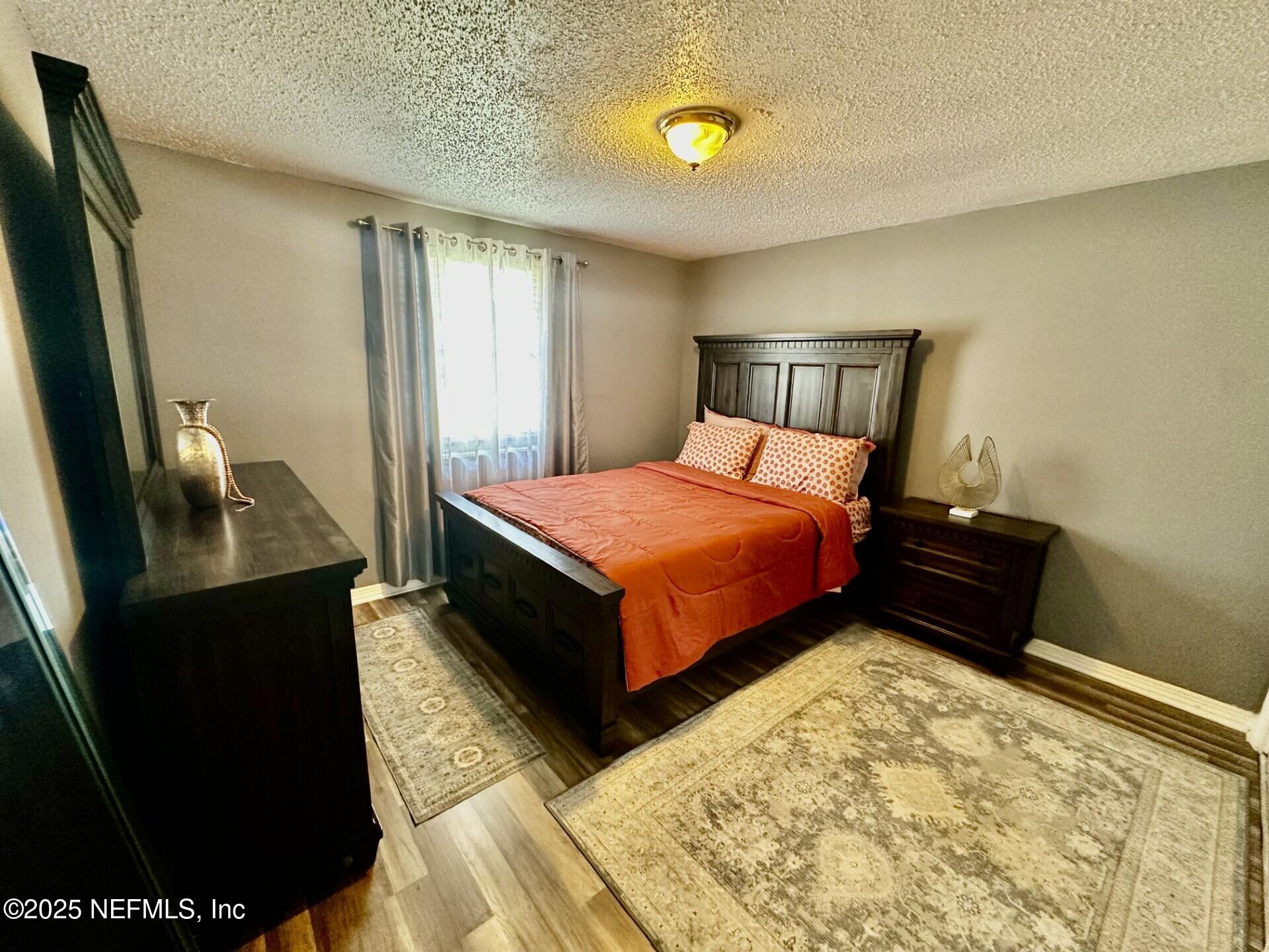 1540 El Prado Road, Unit 3 Jacksonville, FL 32216 - Photo 12 of 26 a bedroom with a bed and window