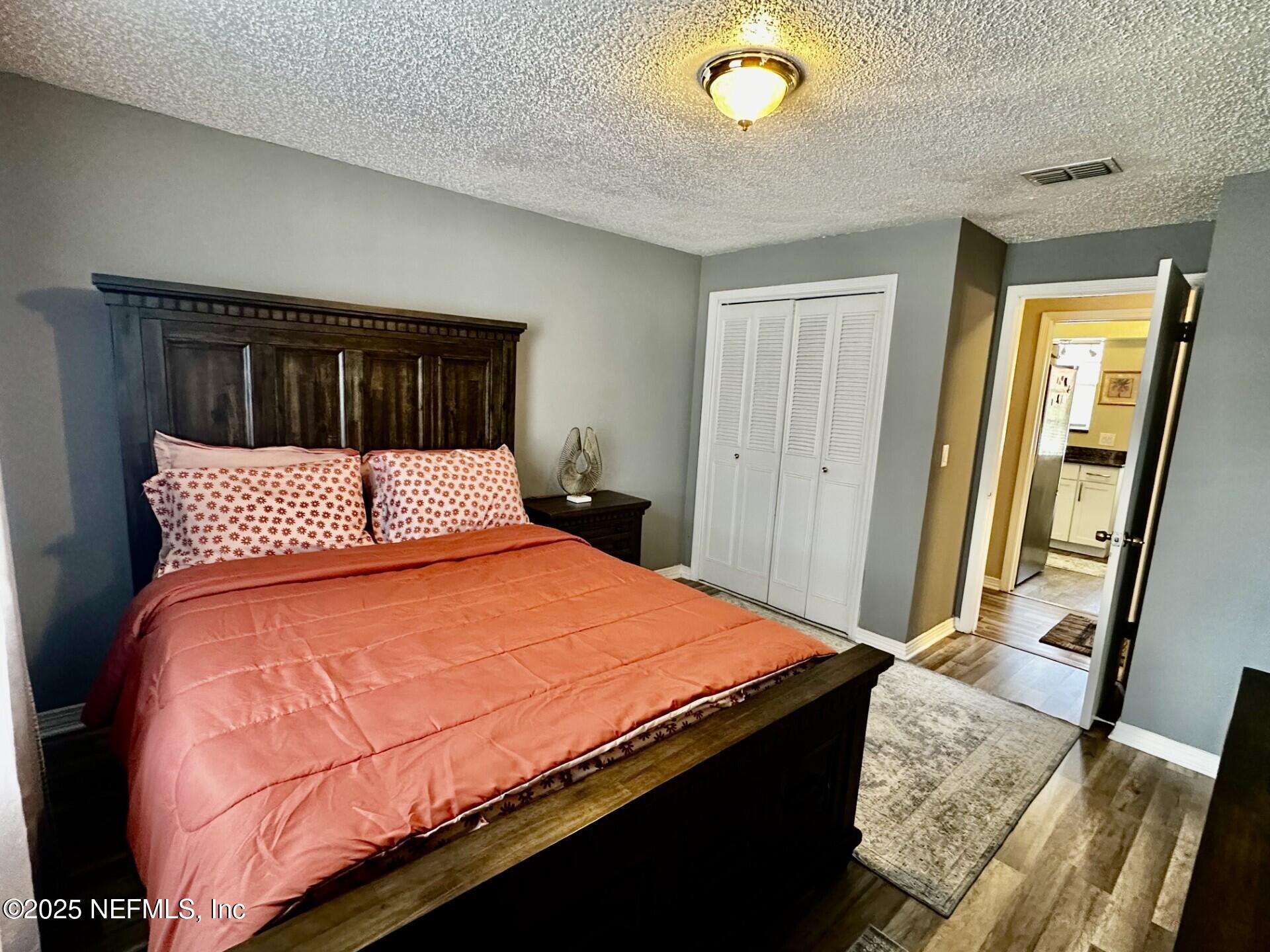 1540 El Prado Road, Unit 3 Jacksonville, FL 32216 - Photo 14 of 26 a bedroom with a bed and a dresser