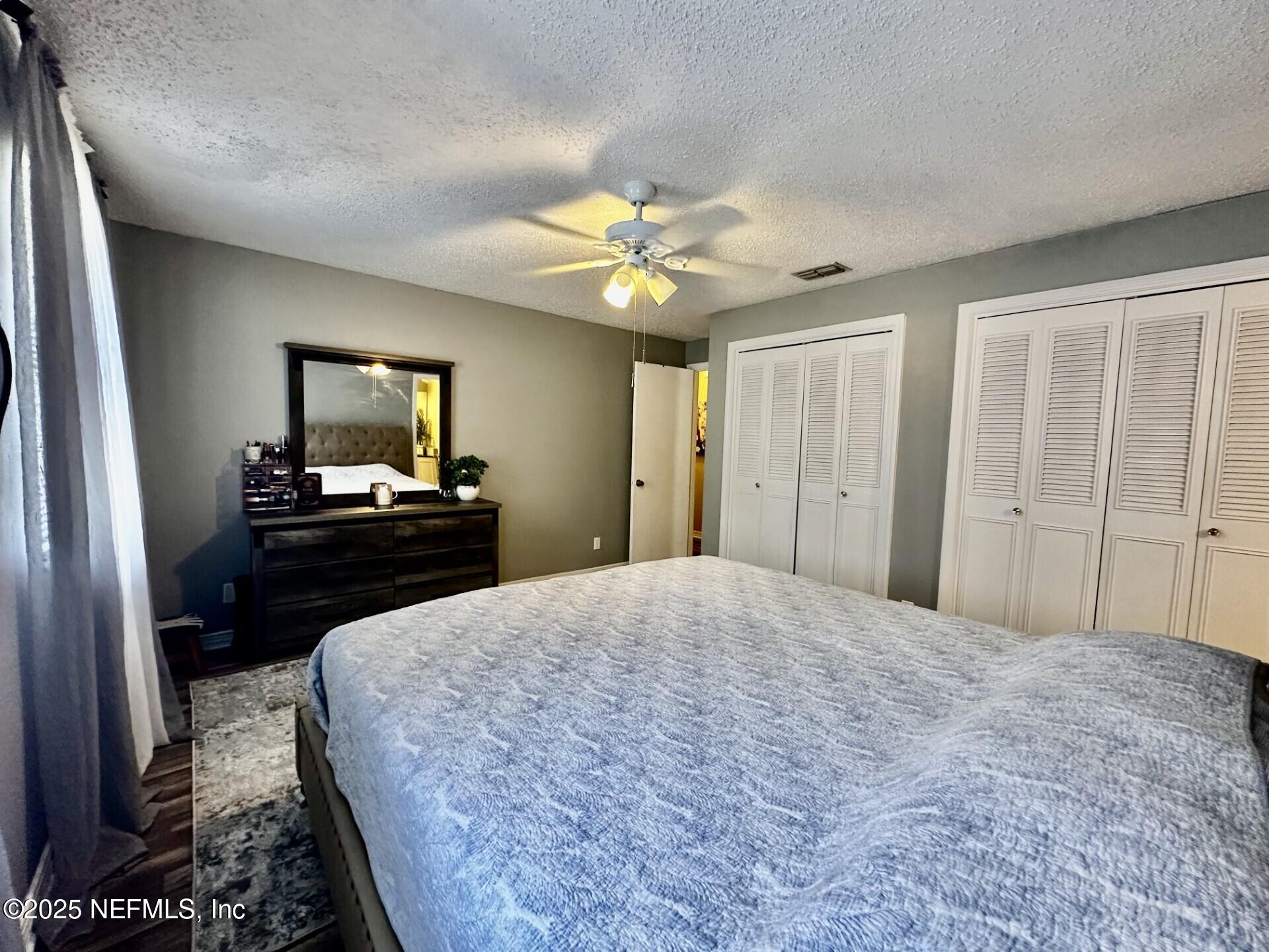 1540 El Prado Road, Unit 3 Jacksonville, FL 32216 - Photo 18 of 26 a bedroom with a bed and a bathroom