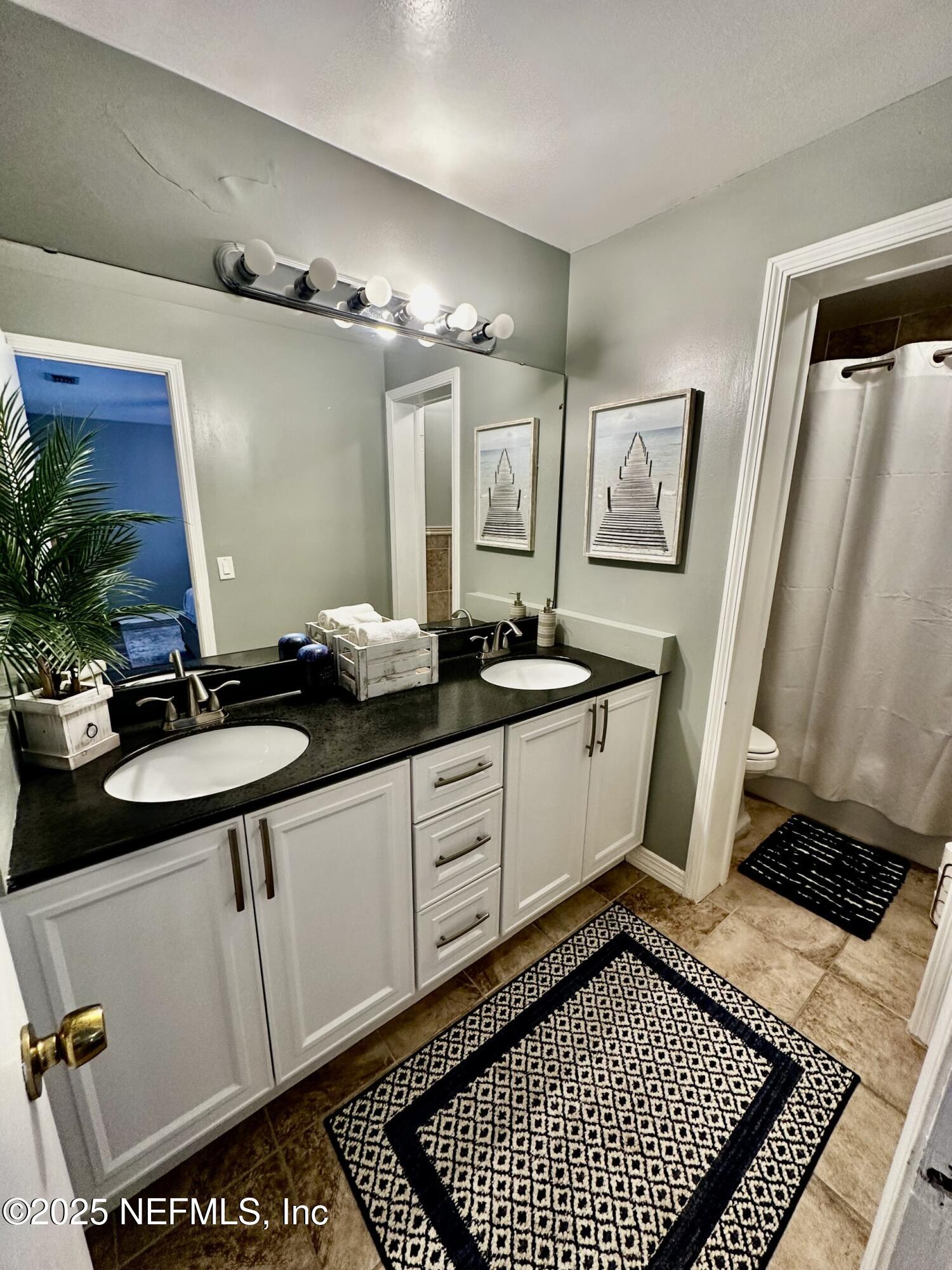 1540 El Prado Road, Unit 3 Jacksonville, FL 32216 - Photo 19 of 26 a kitchen with a sink and cabinets