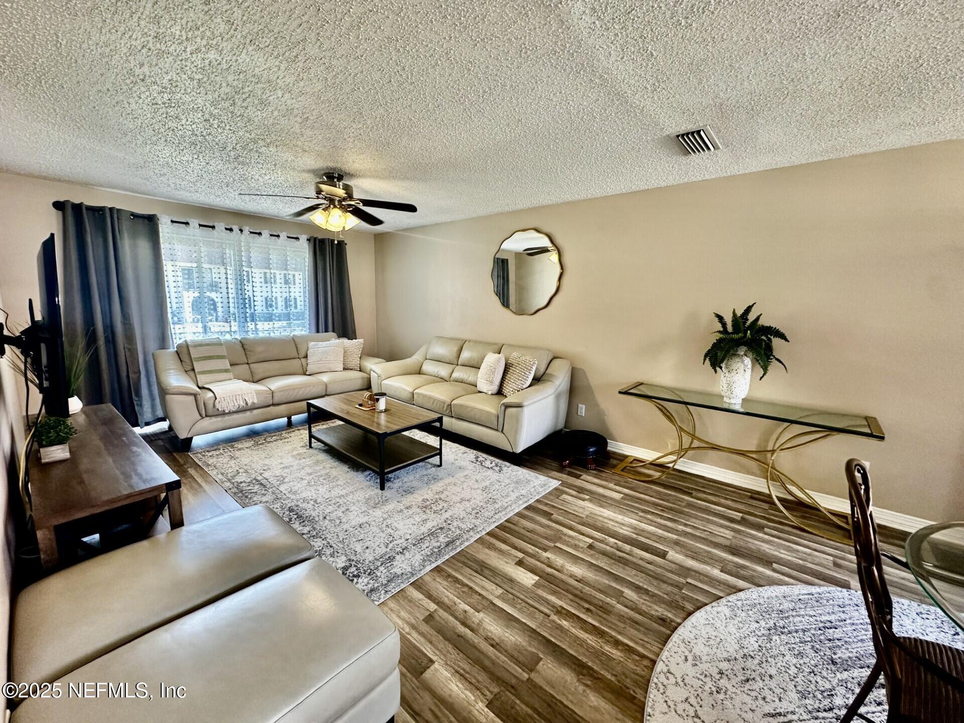 1540 El Prado Road, Unit 3 Jacksonville, FL 32216 - Photo 5 of 26 a living room with furniture and a window