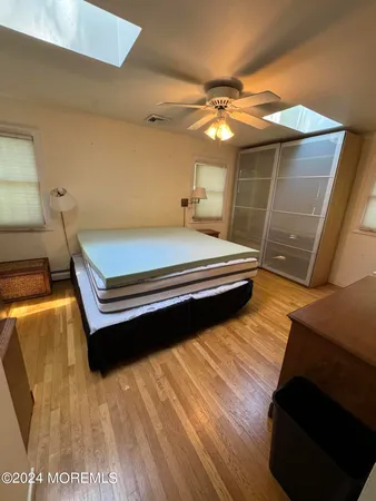 a room with pool table and window