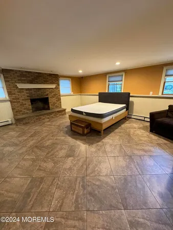a spacious bathroom with a tub and a mirror