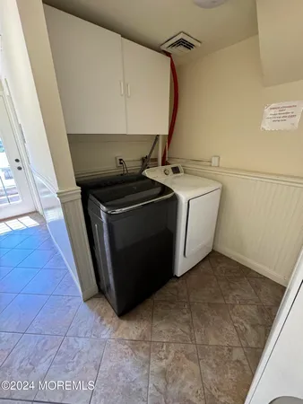 a utility room with washer and dryer
