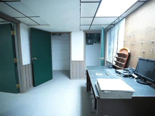 a workspace with furniture and window