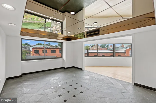 a view of an empty room with a window