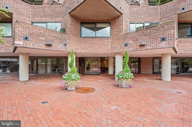 front front view of a brick house with a yard