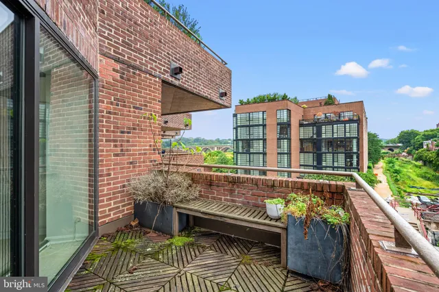 a view of balcony with a potted plant