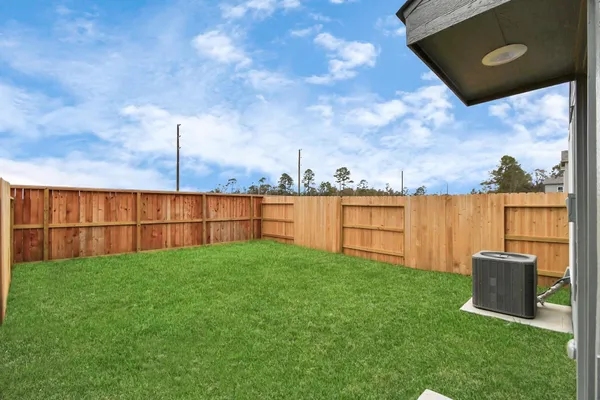 a view of a backyard with potted plants