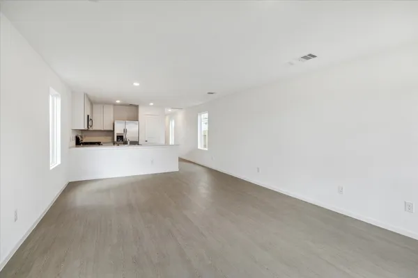 a view of a kitchen with a sink and a window
