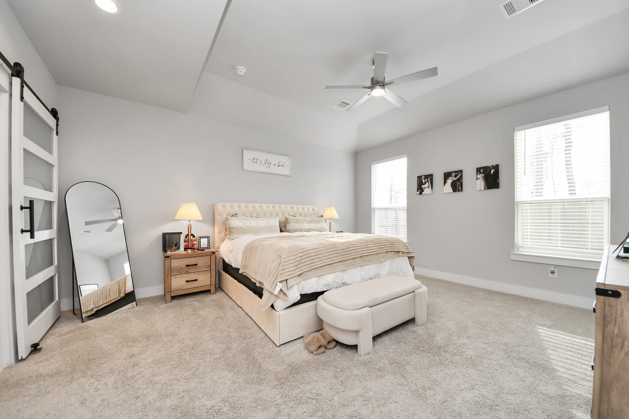1920 Golden Spruce Lane Conroe, TX 77301 - Photo 14 of 28 a spacious bedroom with a bed and a large window