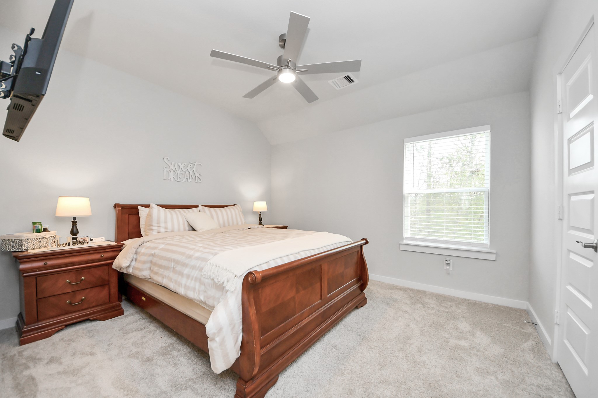 1920 Golden Spruce Lane Conroe, TX 77301 - Photo 23 of 28 a spacious bedroom with a bed and window