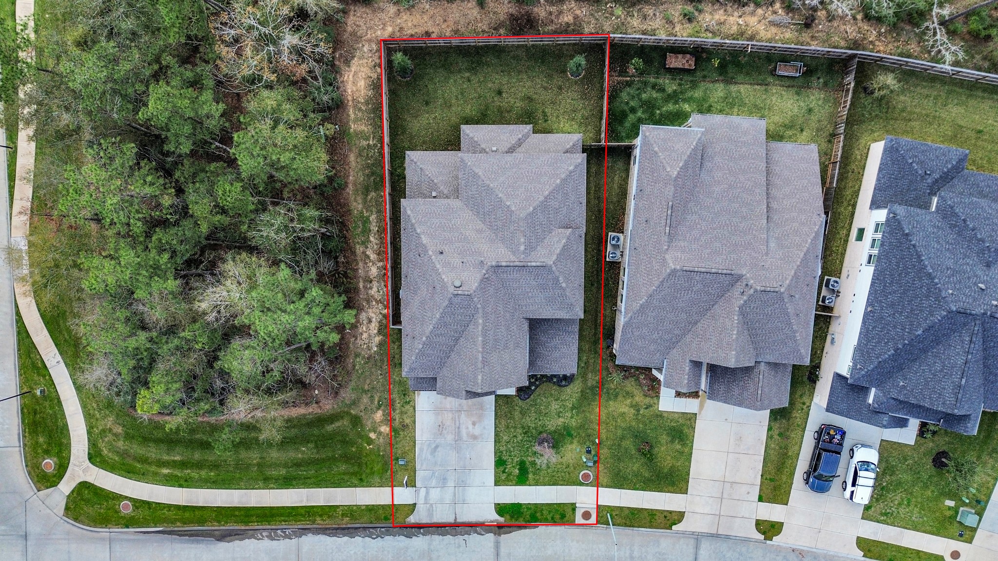 1920 Golden Spruce Lane Conroe, TX 77301 - Photo 28 of 28 an aerial view of a house with outdoor space and a lake view