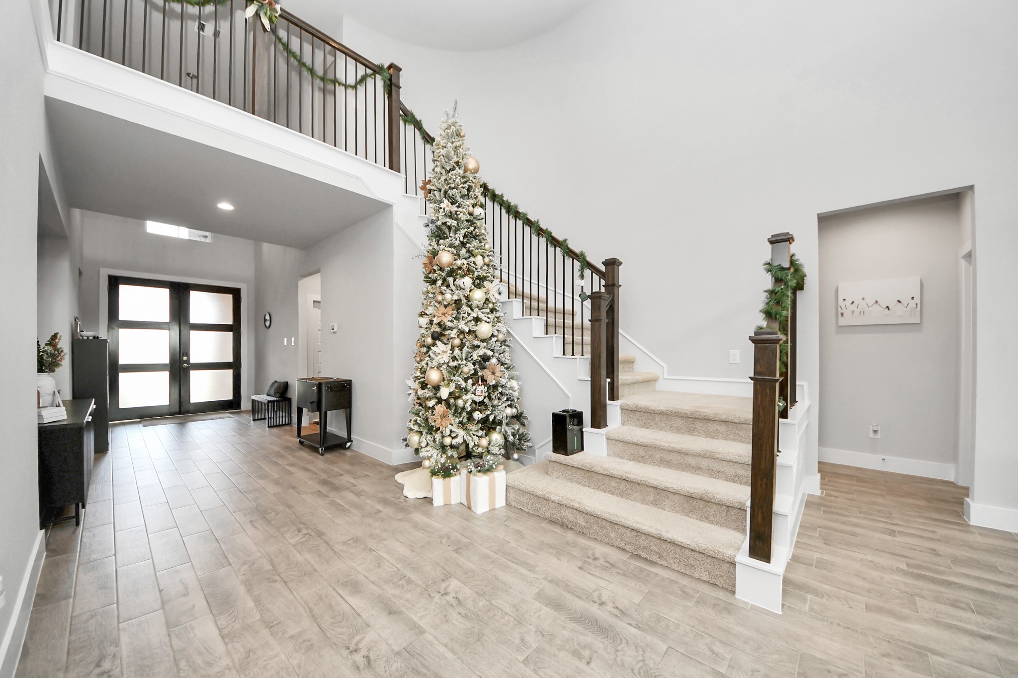 1920 Golden Spruce Lane Conroe, TX 77301 - Photo 8 of 28 a view of entryway with wooden floor and stairs