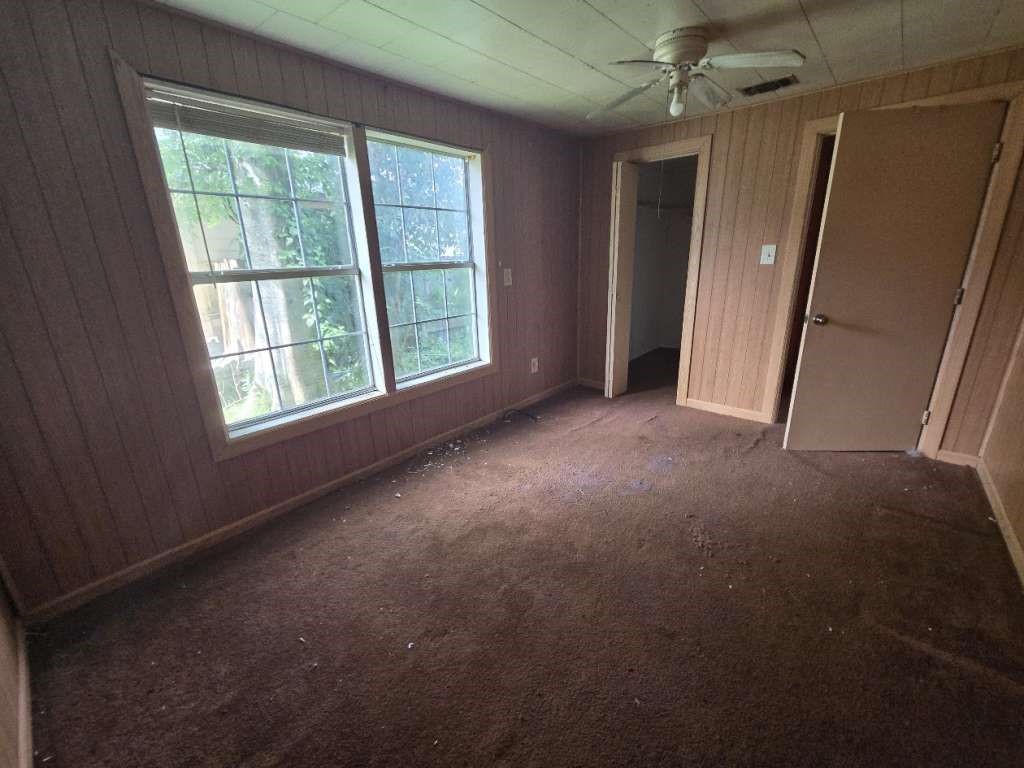 208 South 6th Street Highlands, TX 77562 - Photo 11 of 12 an empty room with windows and entrance