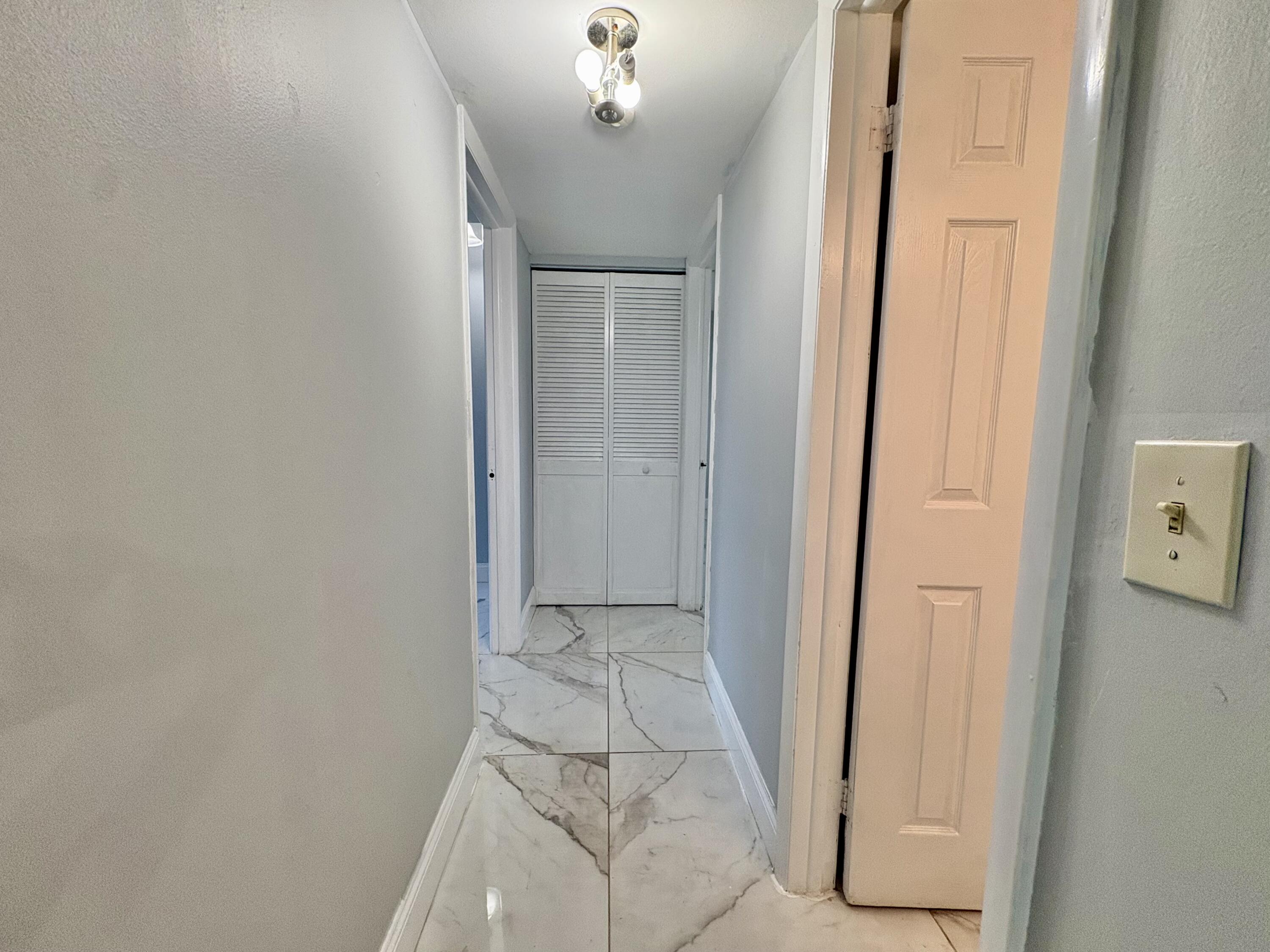 5700 Northwest 2nd Avenue, Unit 311 Boca Raton, FL 33487 - Photo 15 of 33 HALL TO BA AND BR