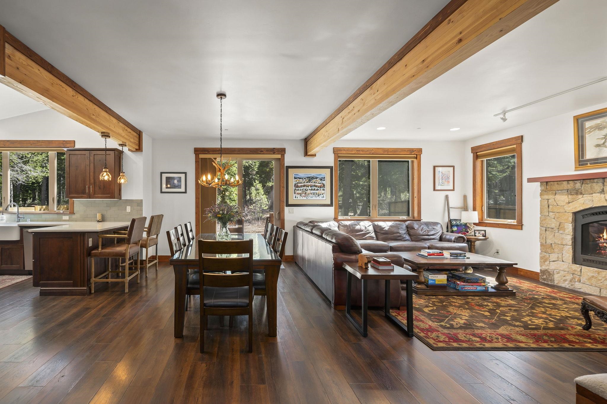 a living room with fireplace furniture and a wooden floor