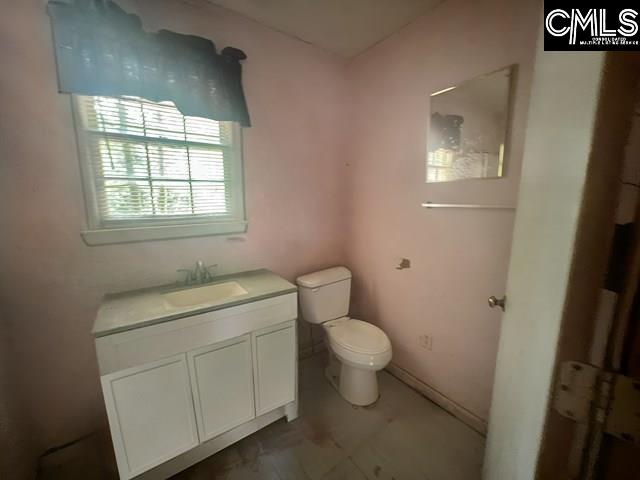 5545 Pisgah Road Rembert, SC 29128 - Photo 10 of 26 a bathroom with a toilet sink and window