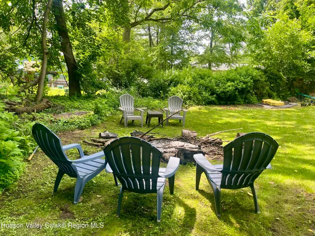 a view of an chairs and table in the patio