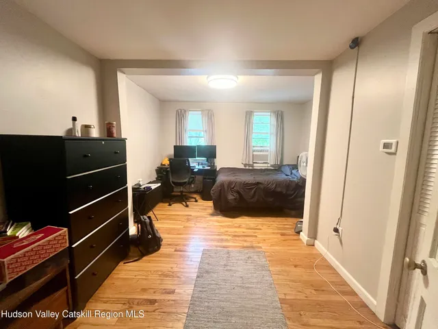 a bed room with a bed and a window