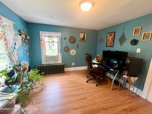 a workspace with furniture and window