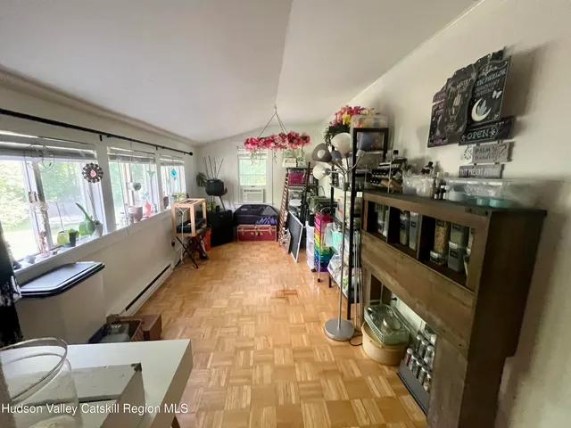 a room with lots of wooden furniture and a mirror