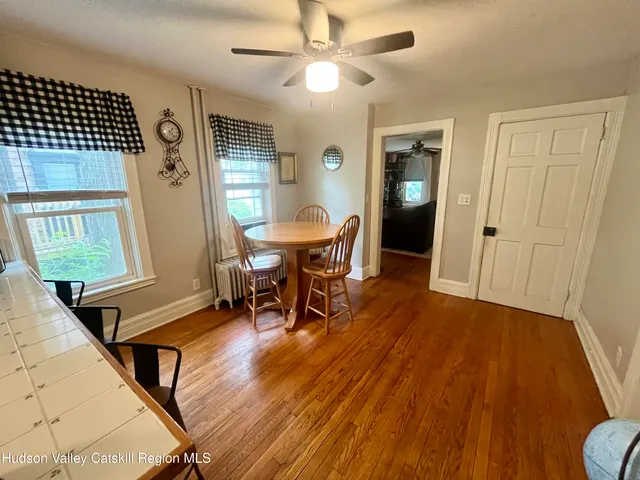 a view of a livingroom with furniture and wooden floor