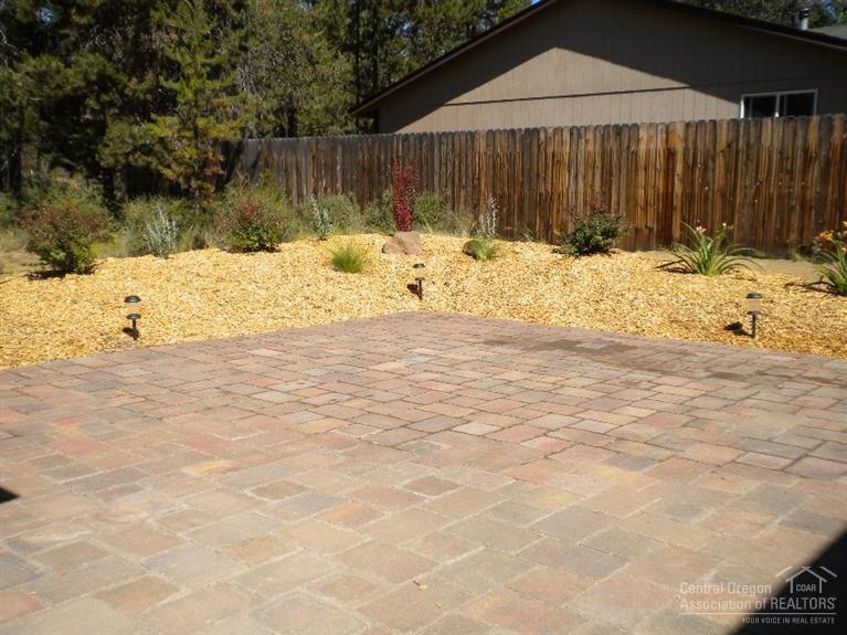 55739 Swan Road Bend, OR 97707 - Photo 20 of 25 Landscaping berm with lights around the