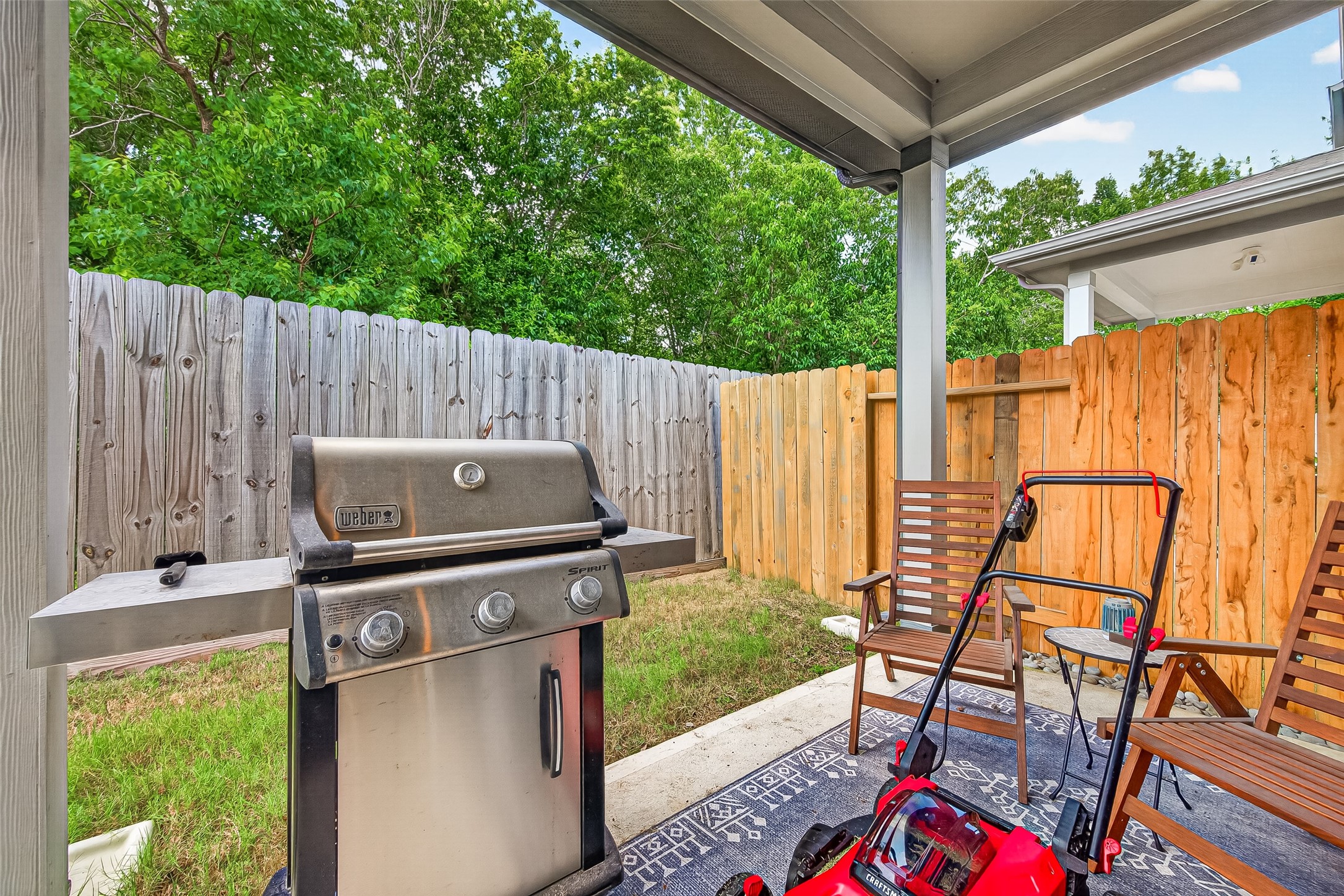 4004 Baja Lane Houston, TX 77045 - Photo 31 of 34 A peaceful and private backyard retreat. Step outside to a beautifully shaded covered patio designed for effortless outdoor relaxation. Quiet, comfortable, and completely enclosed by a sturdy wooden fence, this inviting space provides a serene backdrop for starting your morning with a cup of coffee or enjoying breezy evenings.