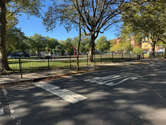 a view of street with large trees